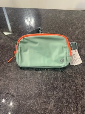 NWT lululemon athletica Mint Green Belt Bag with Orange Trim